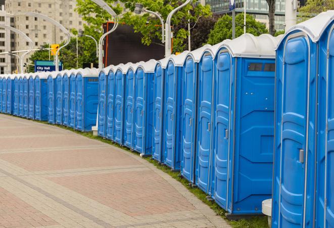 a row of portable restrooms set up for a large athletic event, allowing participants and spectators to easily take care of their needs in Kildeer